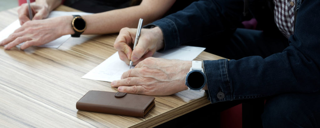 Adult woman and man sign a separation agreement